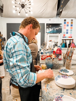 Professional artist sketching the mural composition